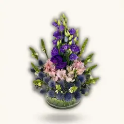 A Touch of Luxury A Glass Vase with Natural Roses in Purple and Pink